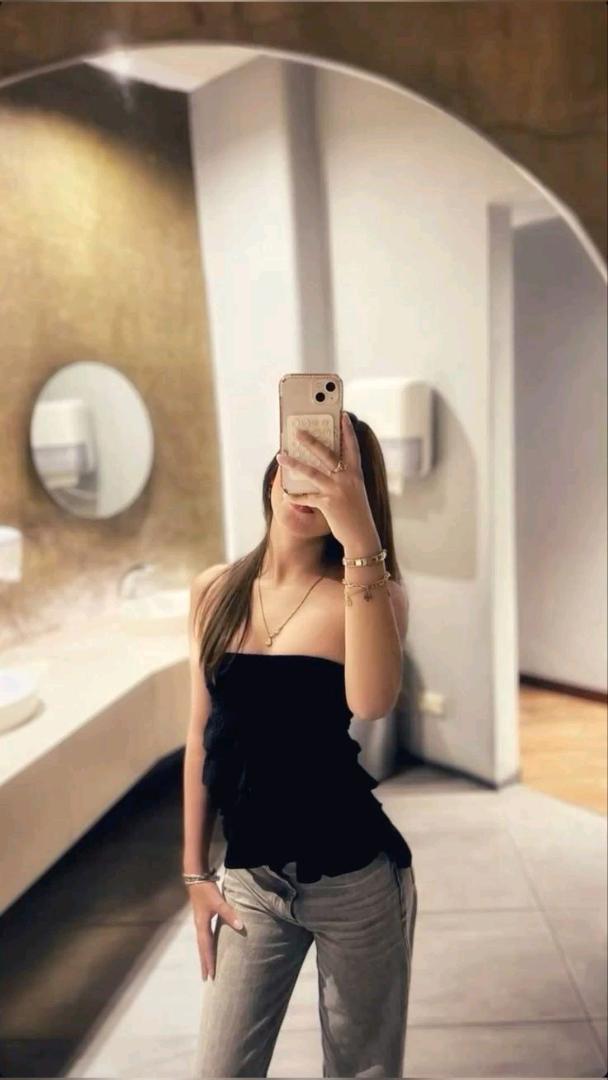 Woman with her phone in hand at home