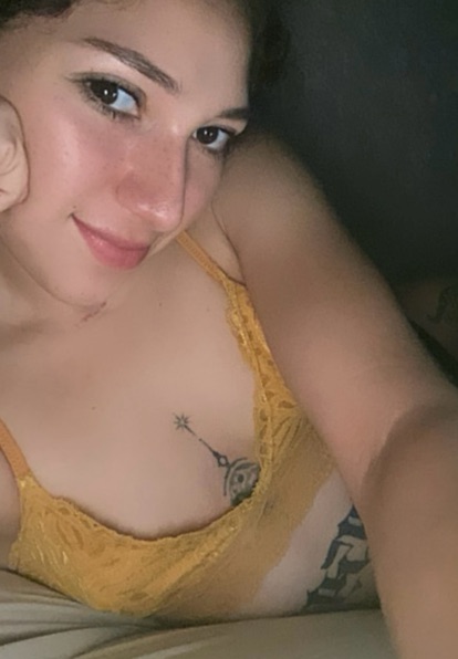 Woman relaxed at home on a video call in soft evening light